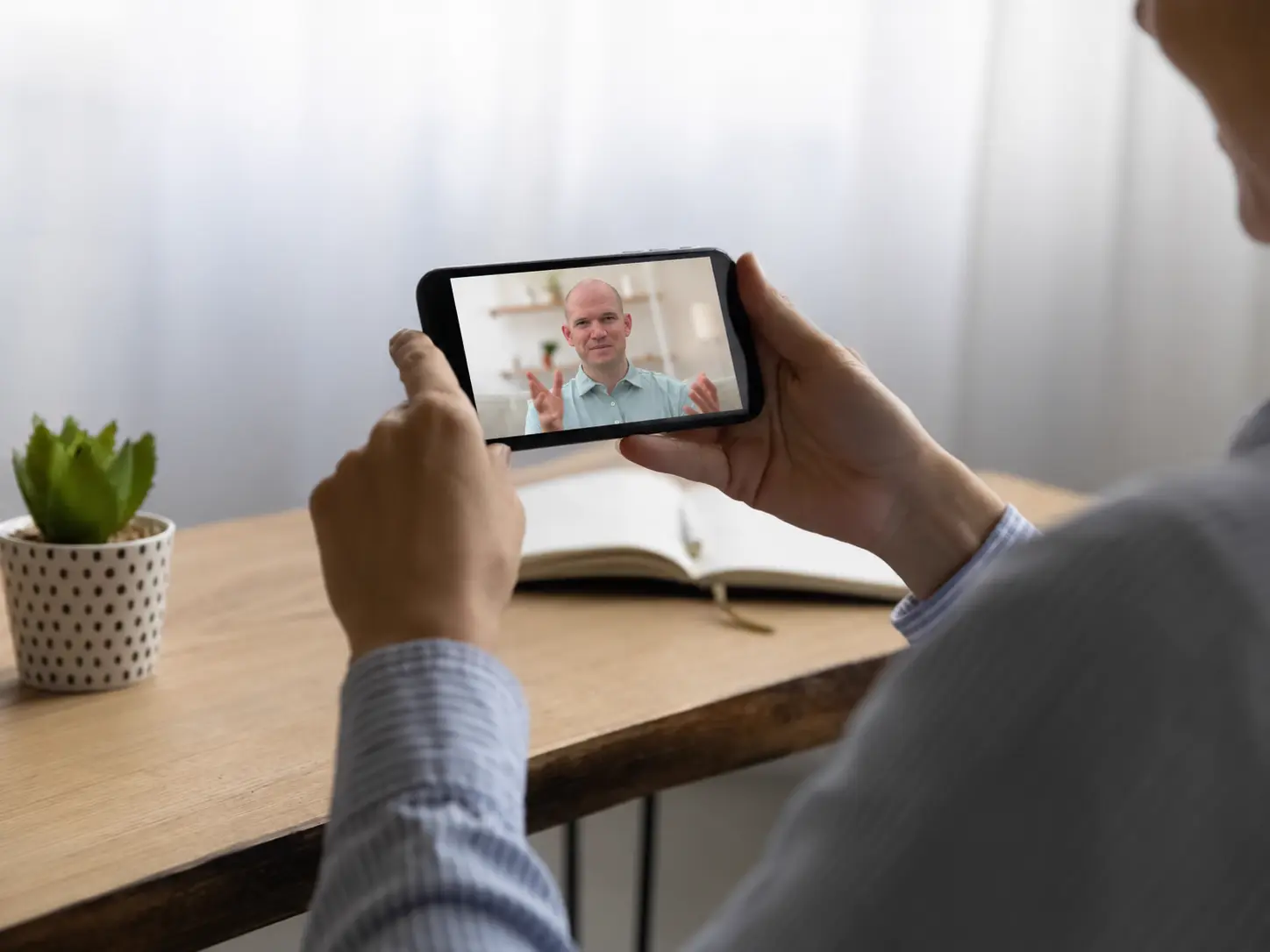 Physiotherapist providing advice during an online teleconsultation